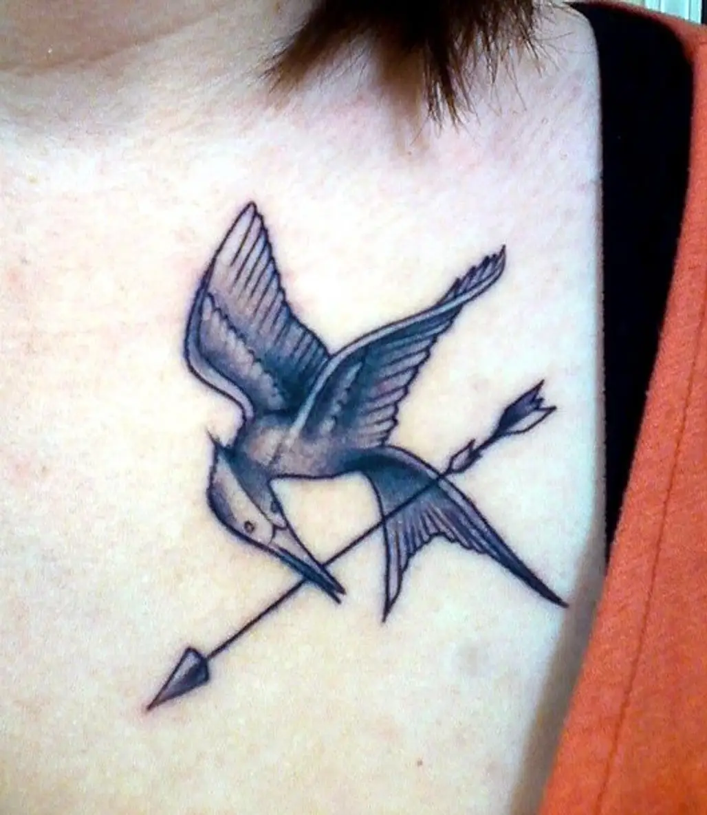 Mockingjay tattoo idea | TattoosAI
