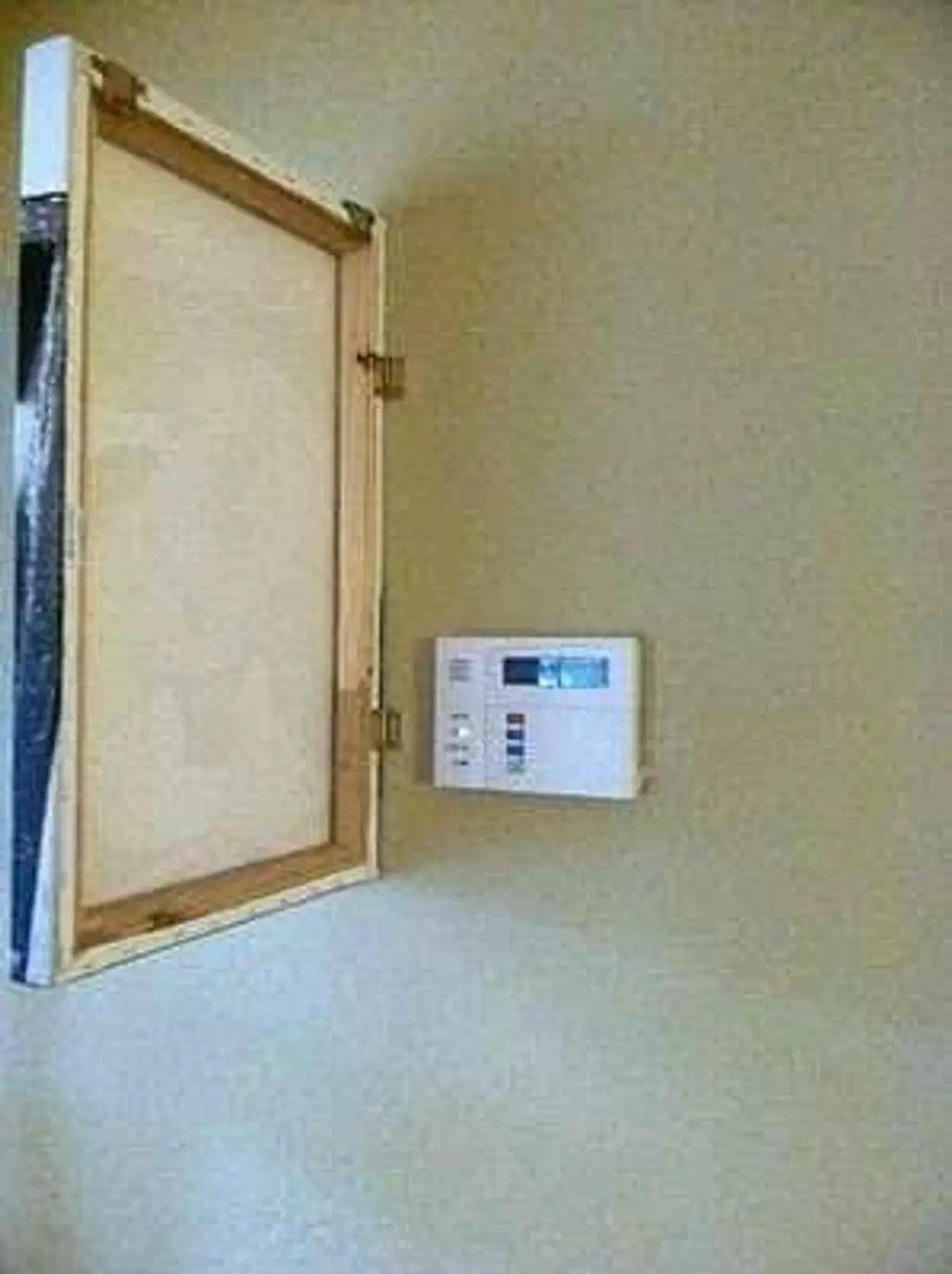 Hide the Thermostat with a Hinged Painting
