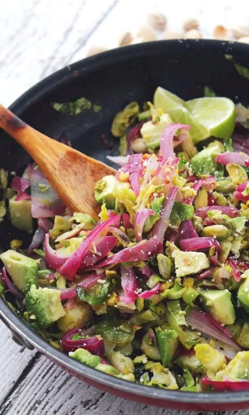 Sauteed Salad Packed with Shaved Brussels Sprouts, Red Onions, Avocado, Pistachios and a Splash of Lime Juice