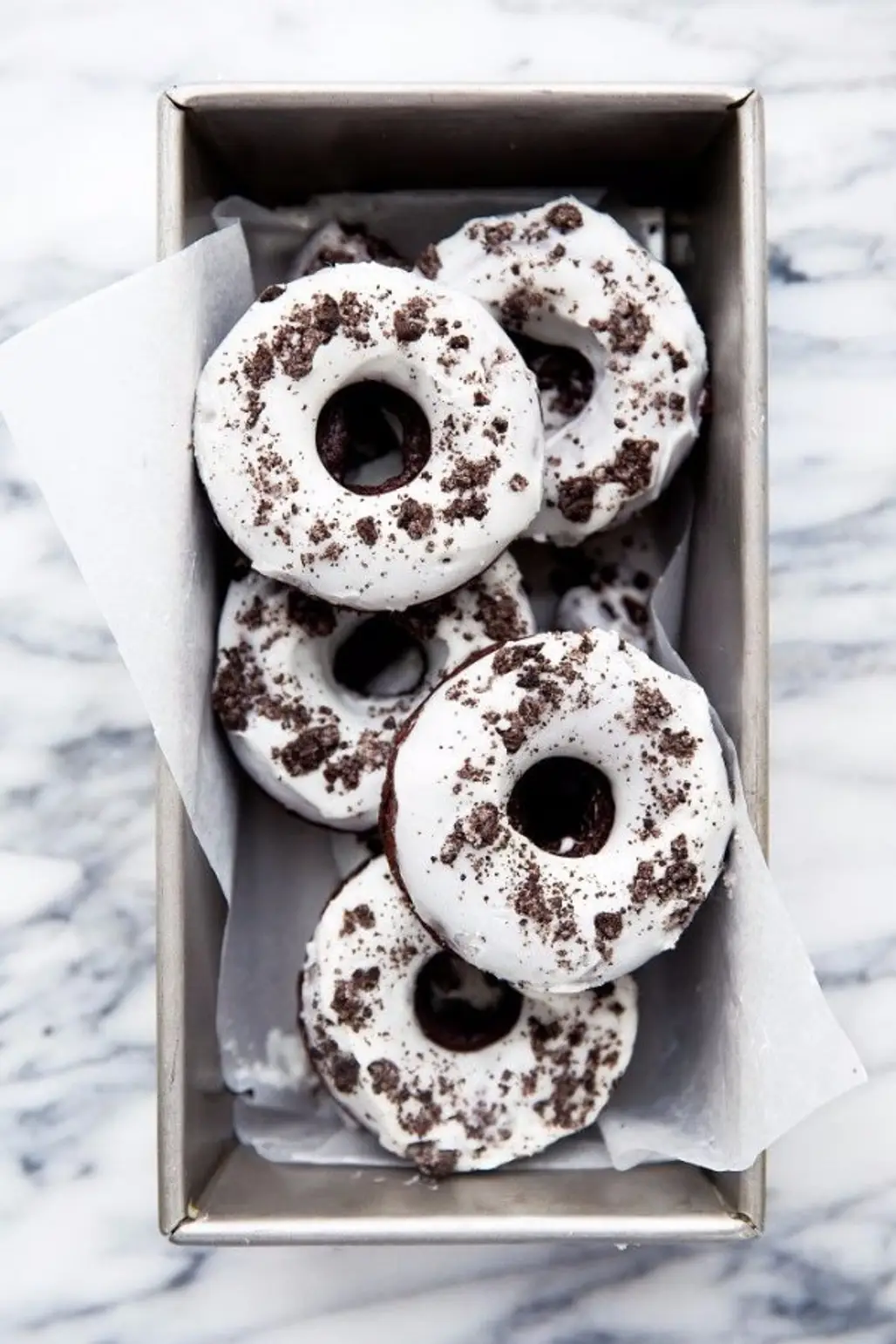 Chocolate Donuts with Crushed Oreo Cookies and a Vanilla Glaze