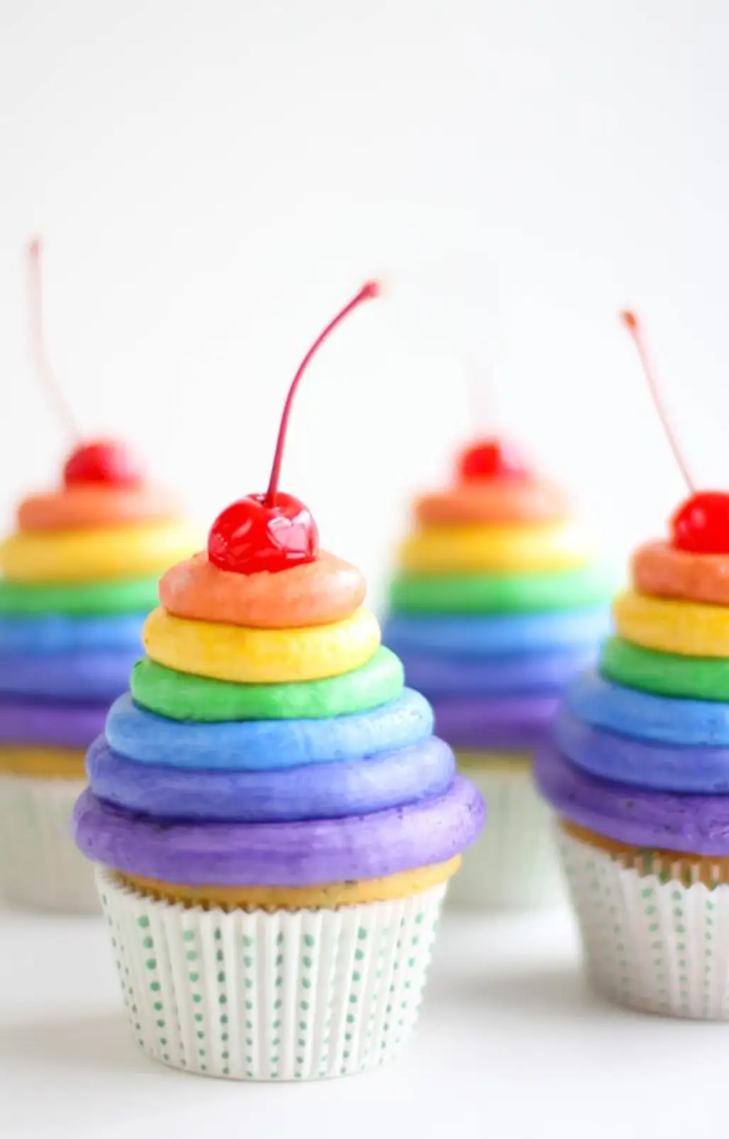 Cupcakes with Mounds of Rainbow Frosting