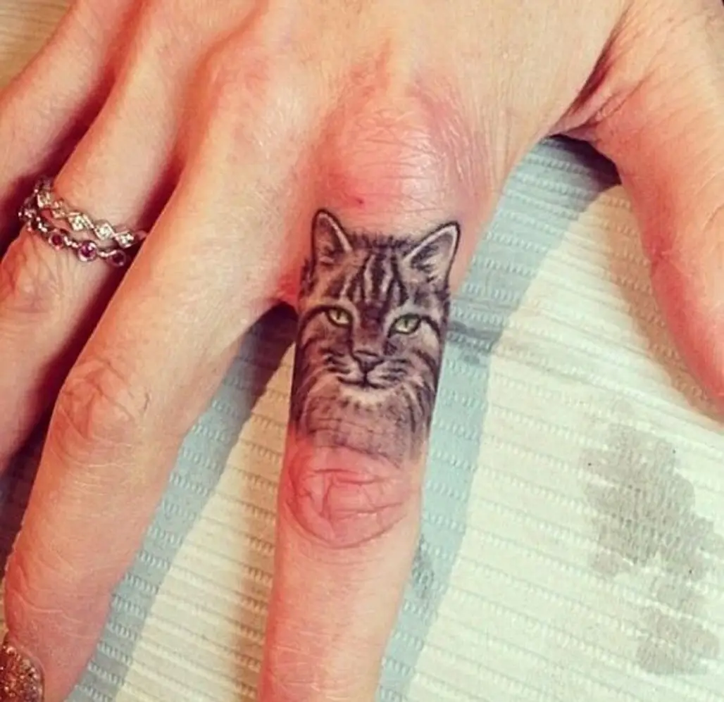 Cute Black Cat Tattoo On Ring Finger | Cute cat tattoo, Free tattoo  designs, Tattoo designs for girls