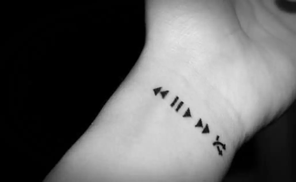 Please design a minimalist yet elegant wrist tattoo that cleverly  intertwines the symbolic essence of an