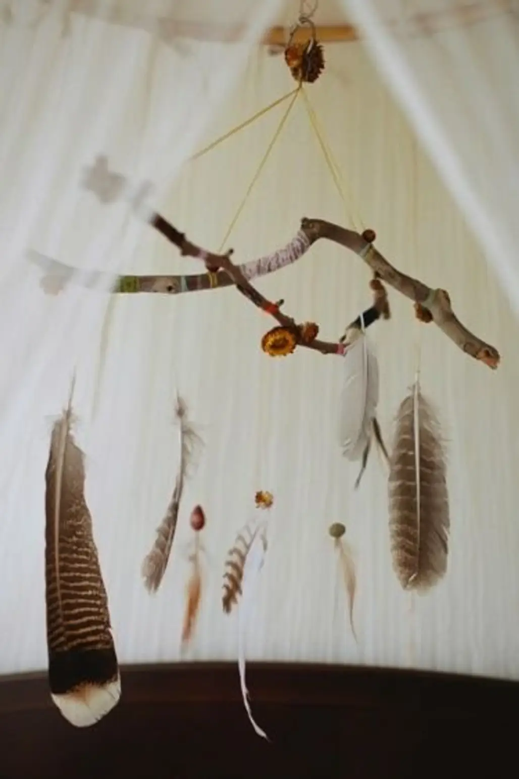 Go a Bit Boho with a Branch and Feather Mobile