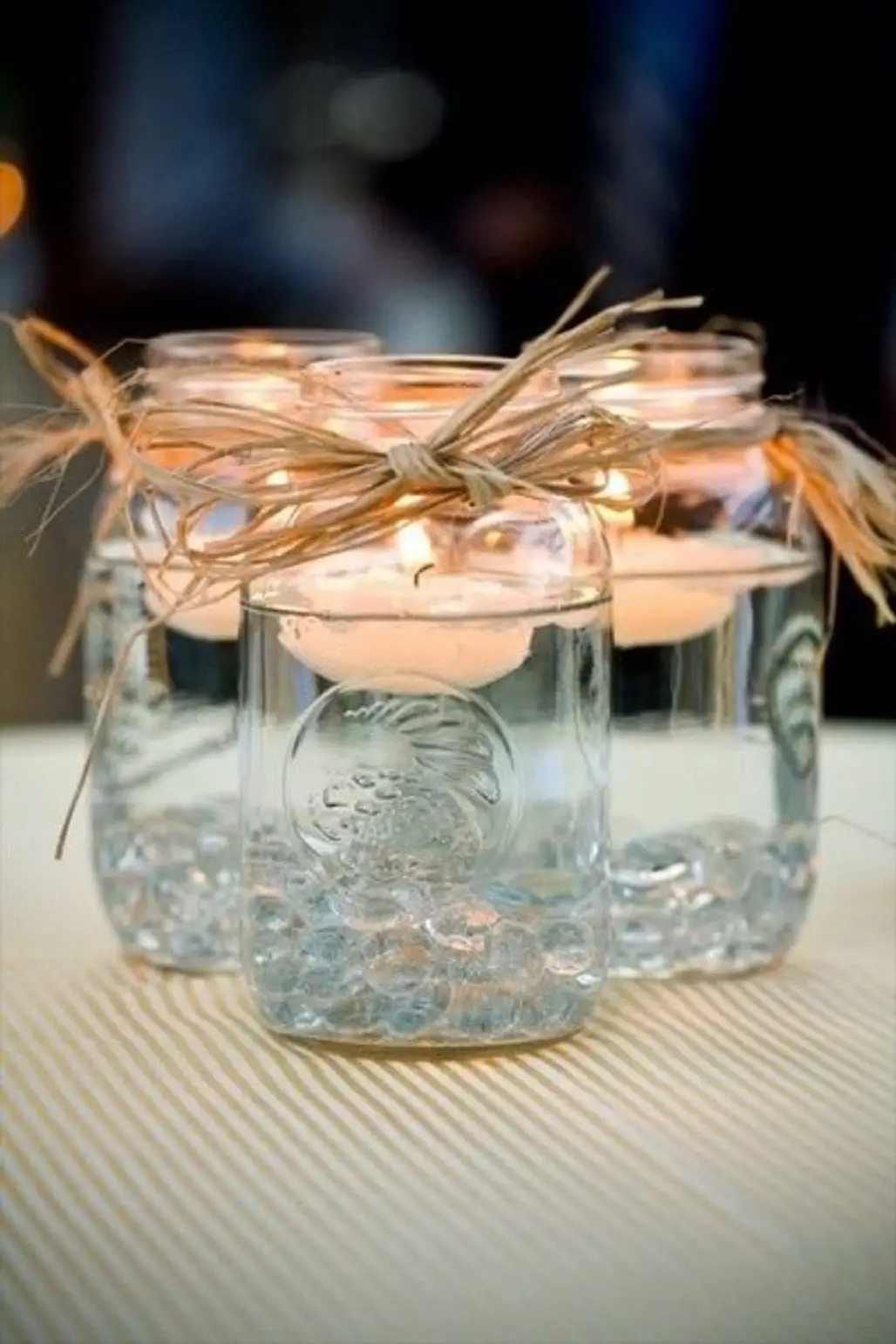 Use Mason Jars and Floating Candles for Centerpieces in a Pinch