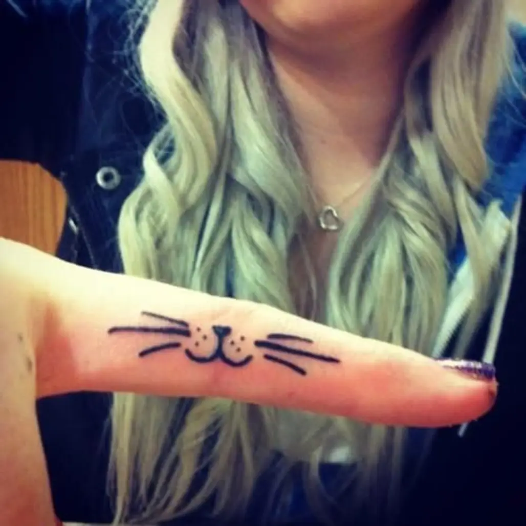 tattoo,arm,finger,hand,human body,