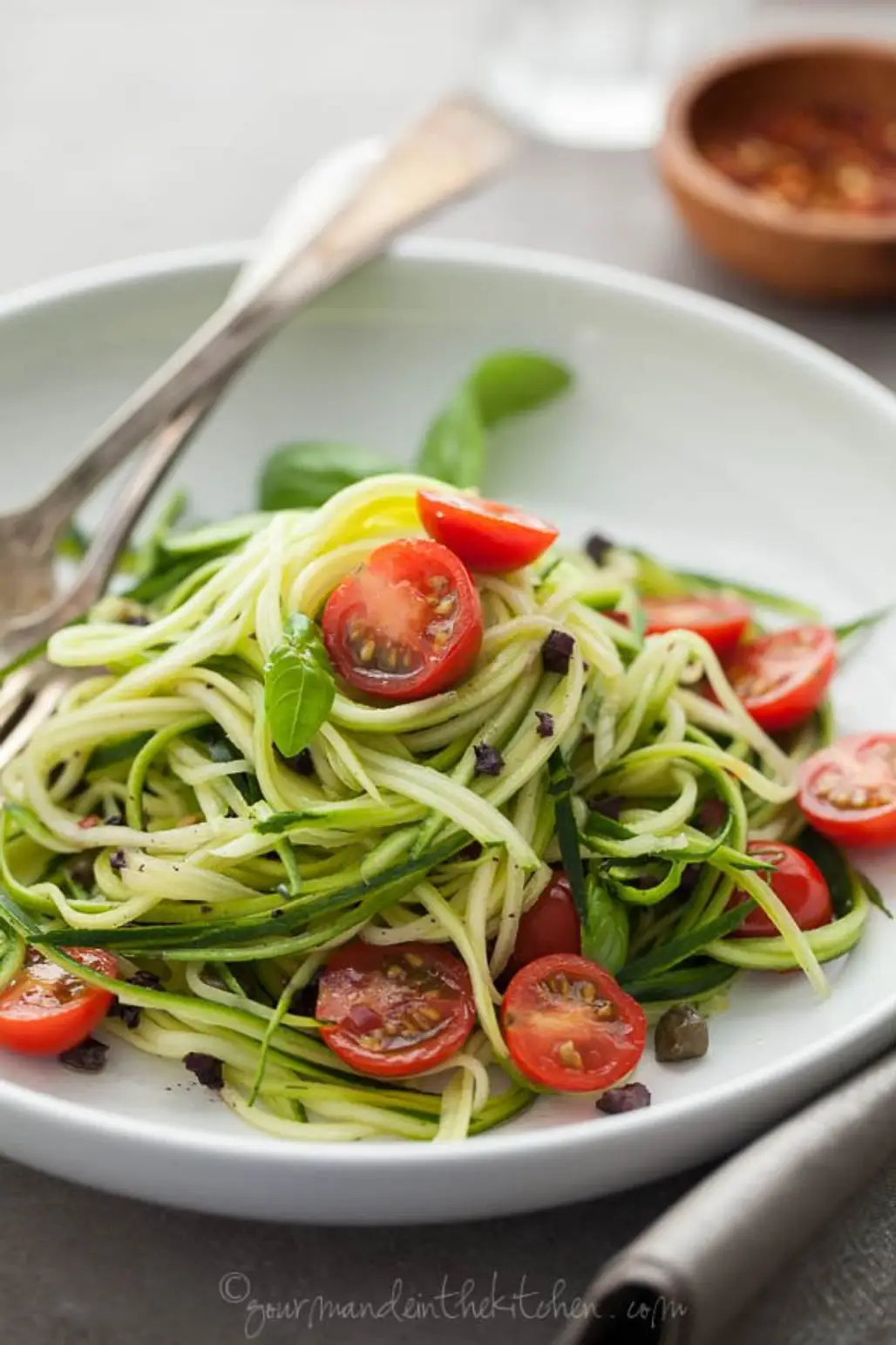 ZUCCHINI NOODLES with CAPER OLIVE SAUCE and FRESH TOMATOES