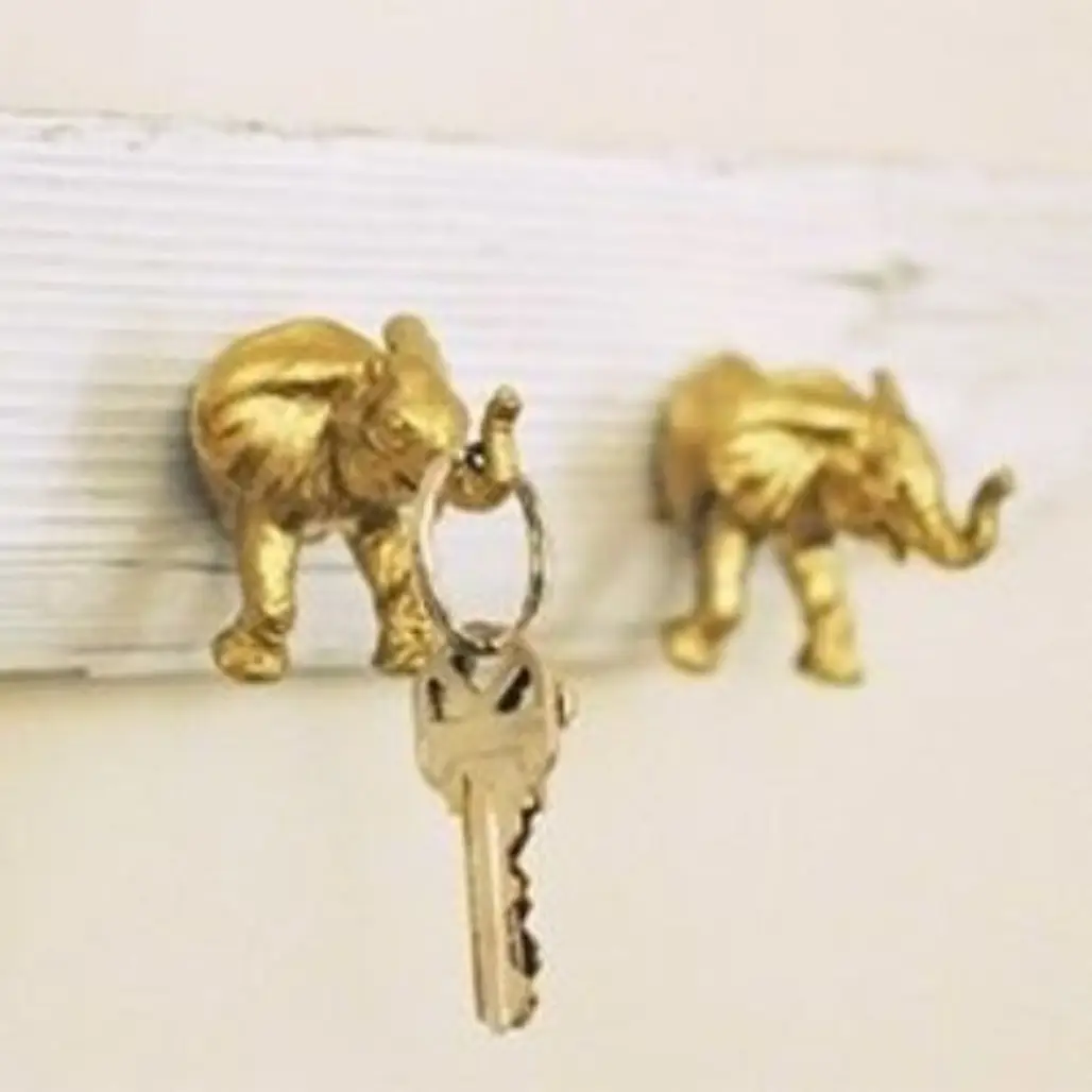 Use Plastic Toy Elephants, Gold Spray Paint, and Driftwood