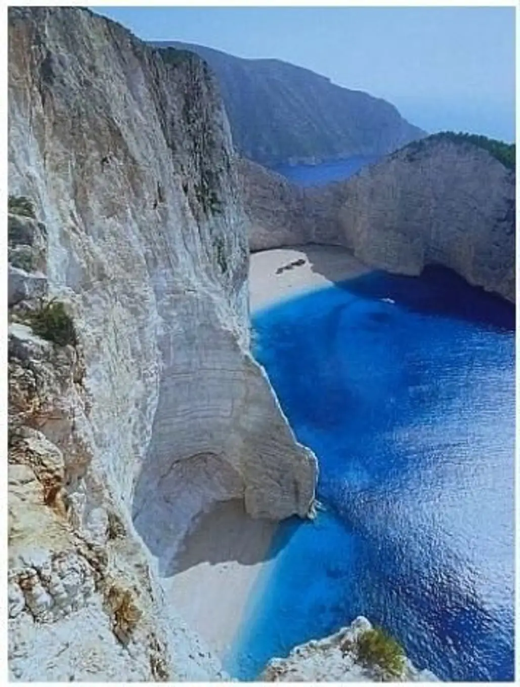 Navagio Bay,landform,geographical feature,cliff,coast,