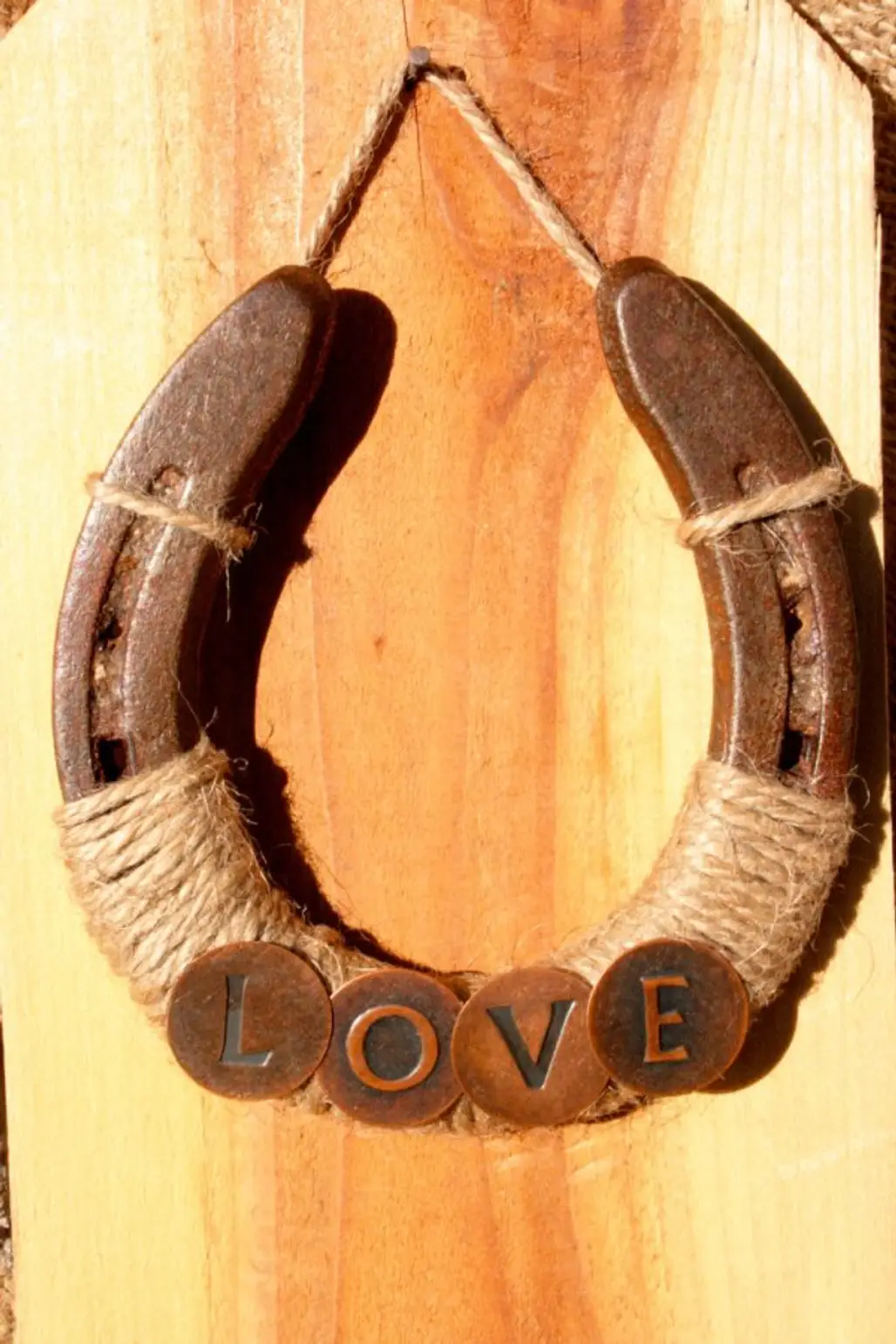 man made object,wood,horn,horseshoe,carving,