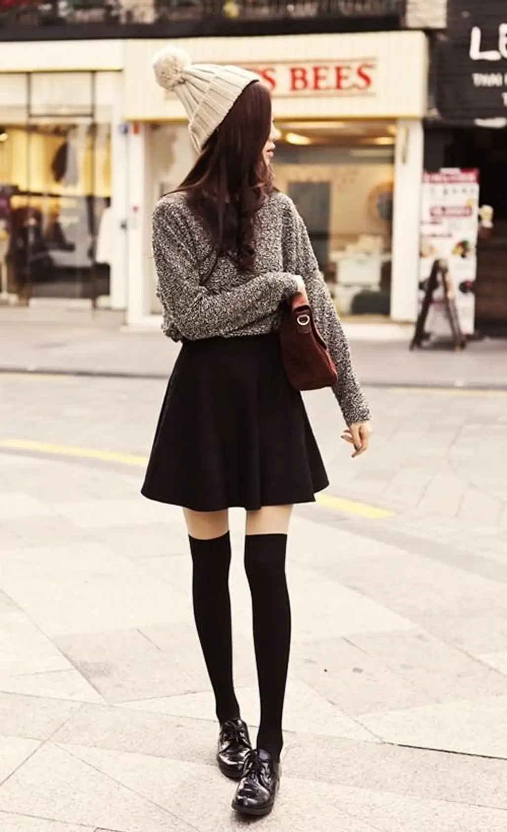Cable-knit Sweater and a Black a-line Skirt