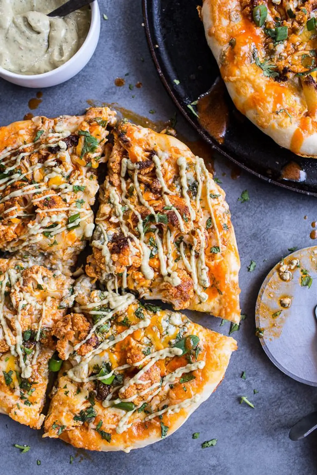Buffalo Roasted Cauliflower Pizza with Chipotle Blue Cheese Avocado Drizzle