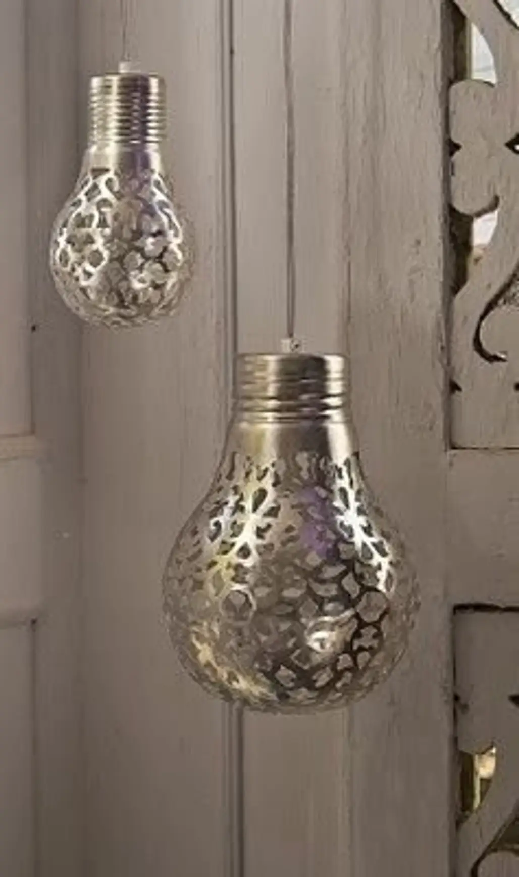 Cover a Light Bulb with a Doily and Spray Paint It