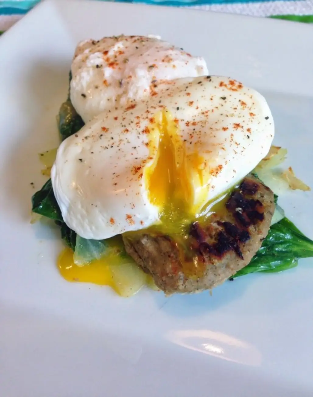 Poached Eggs over Turkey Sausage and Wilted Spinach