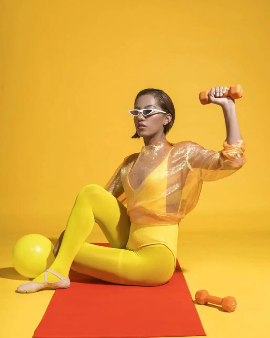 Shoulder, Yellow, Arm, Sitting, Muscle,