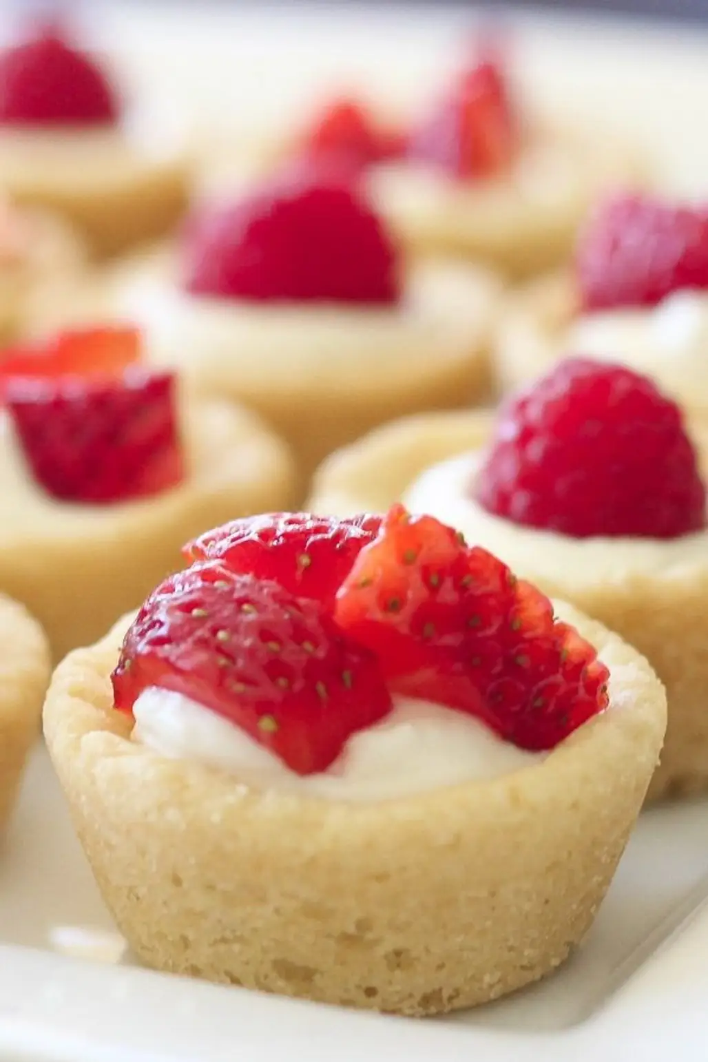 Sugar Cookie Tarts Filled with Sweetened Cream Cheese and Topped with Berries