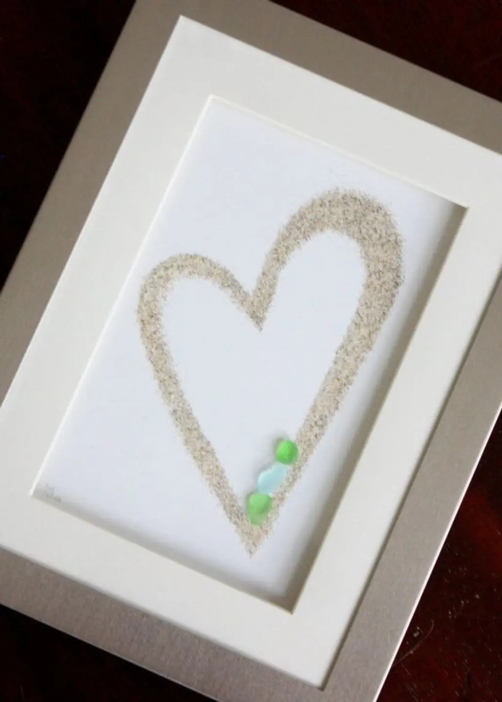 Save Sand from Vacation to Make a Framed Heart with Sea Glass