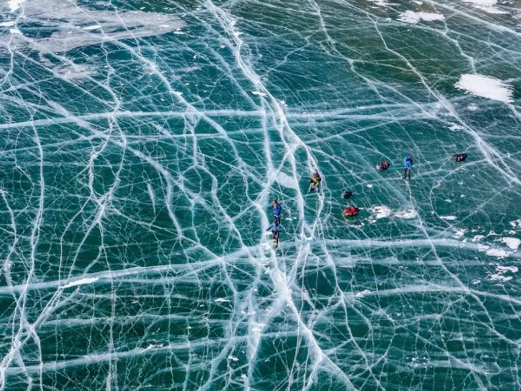Ice Skaters on Lake Baikal, Russia