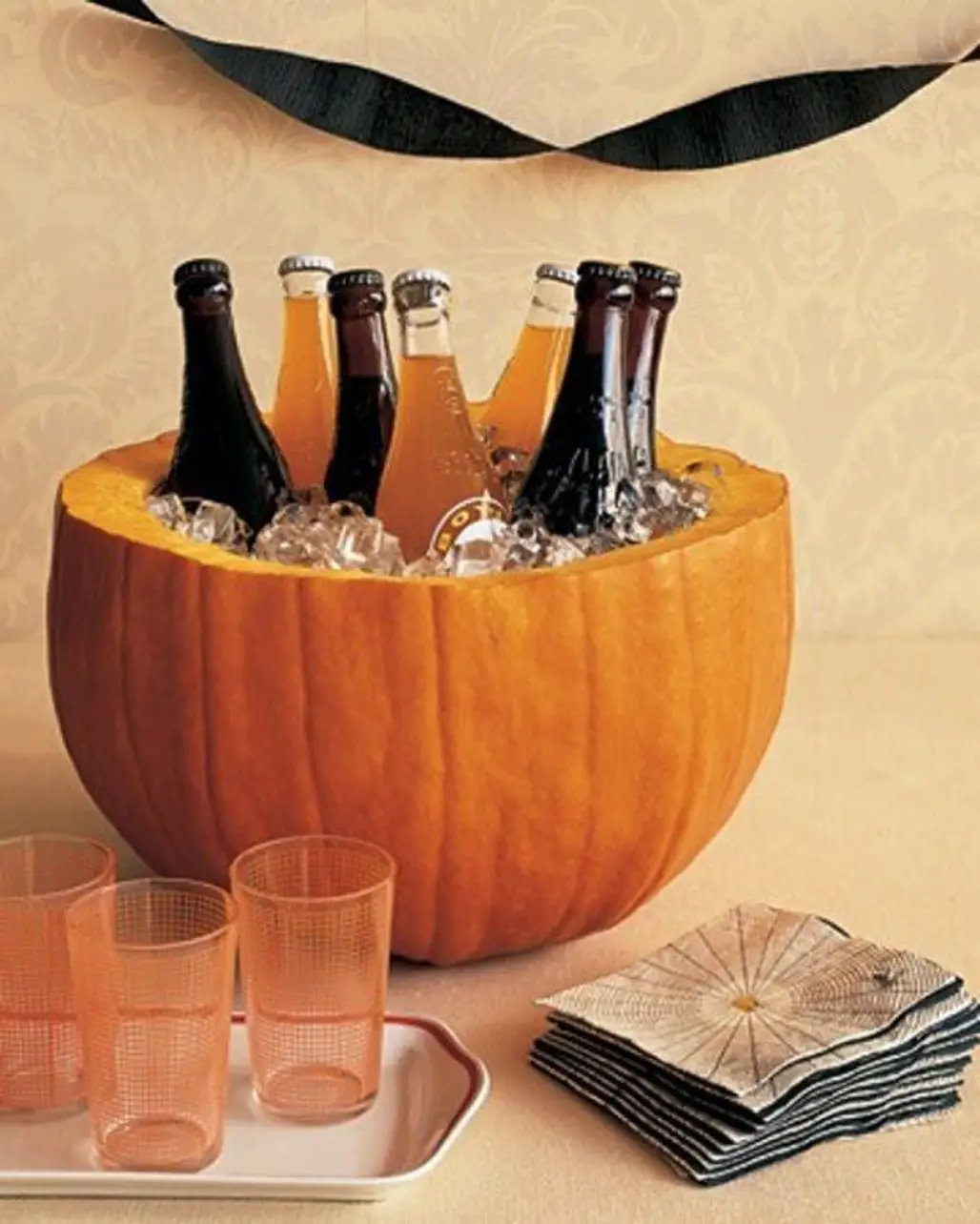Halved Pumpkin, Bowl, Ice and Beer = Perfect Cooler!