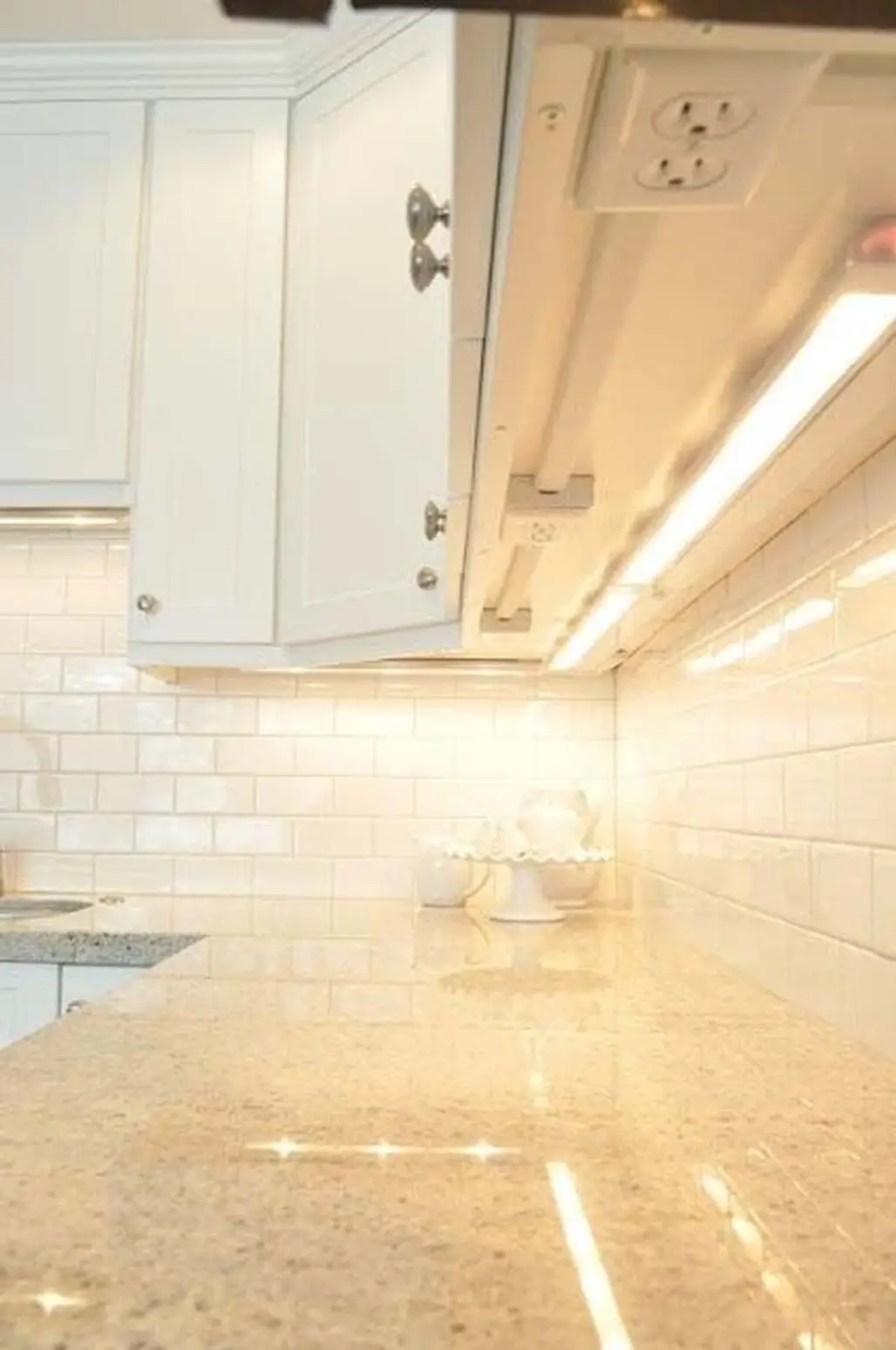 Hide the Outlets under the Cabinets and Create Overhead Lighting