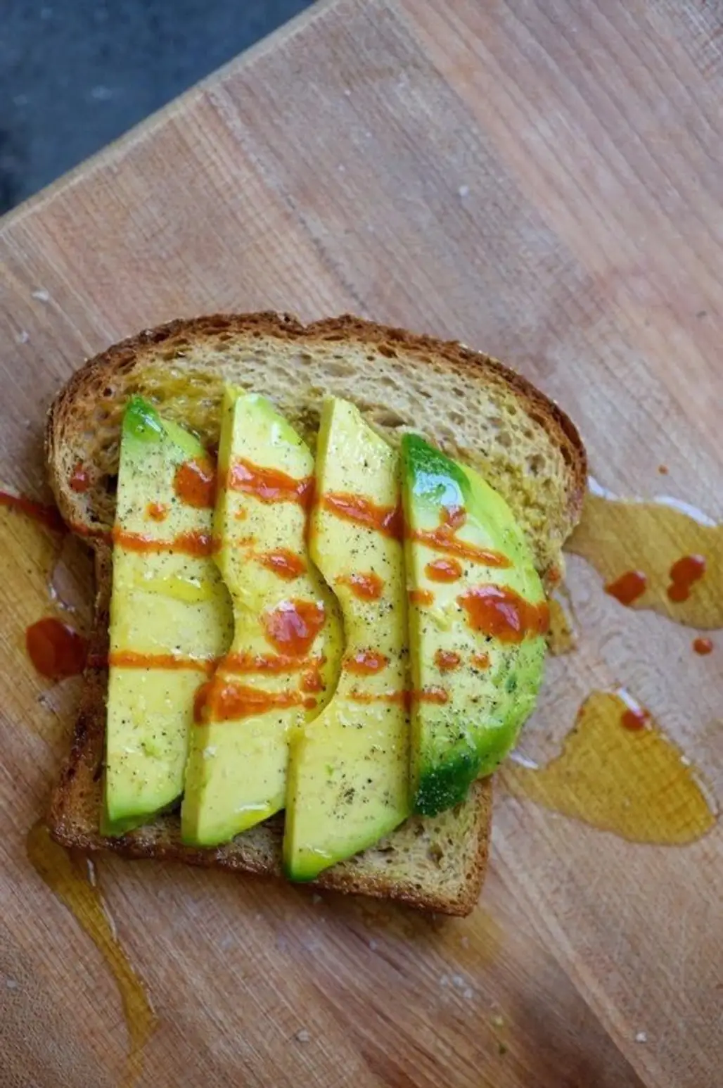 Avocado with a Little Salt, Pepper, and Hot Sauce