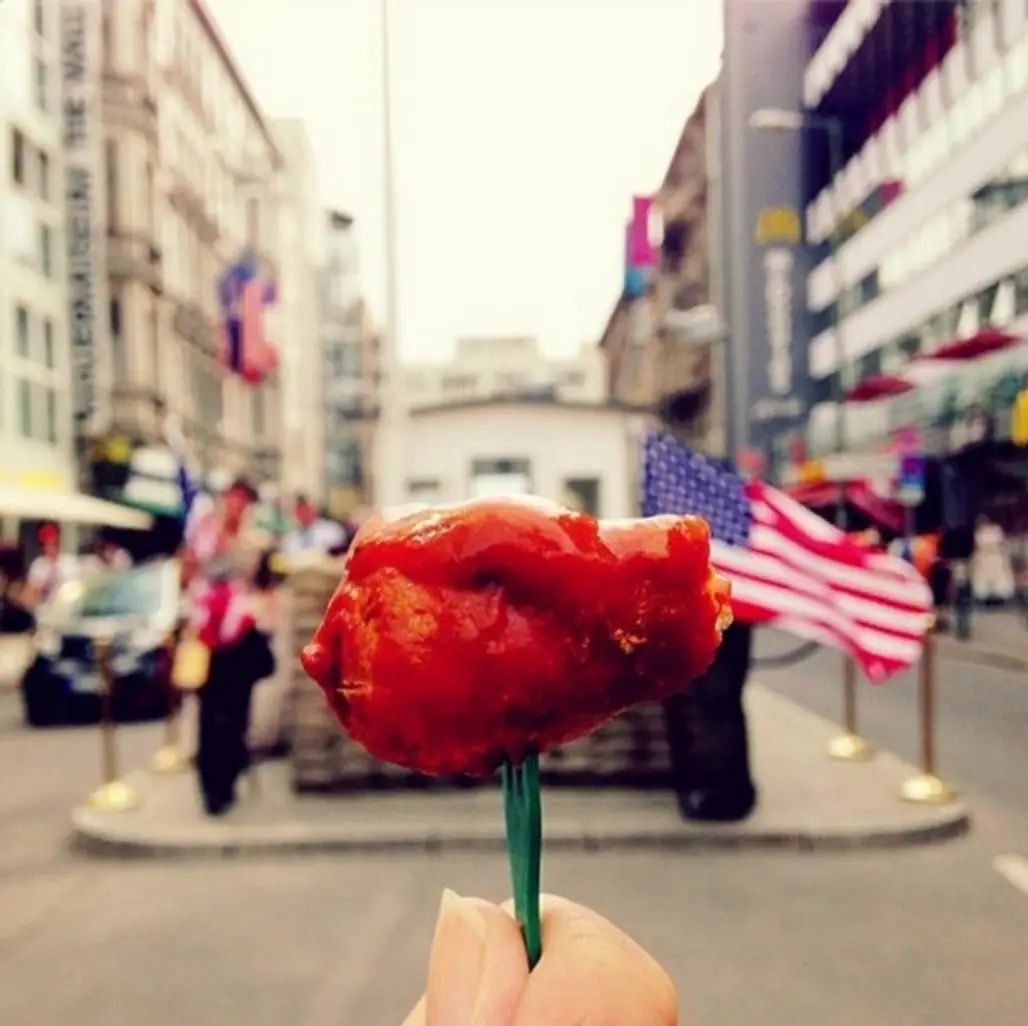 Eat Curry Wurst at Checkpoint Charlie in Berlin, Germany