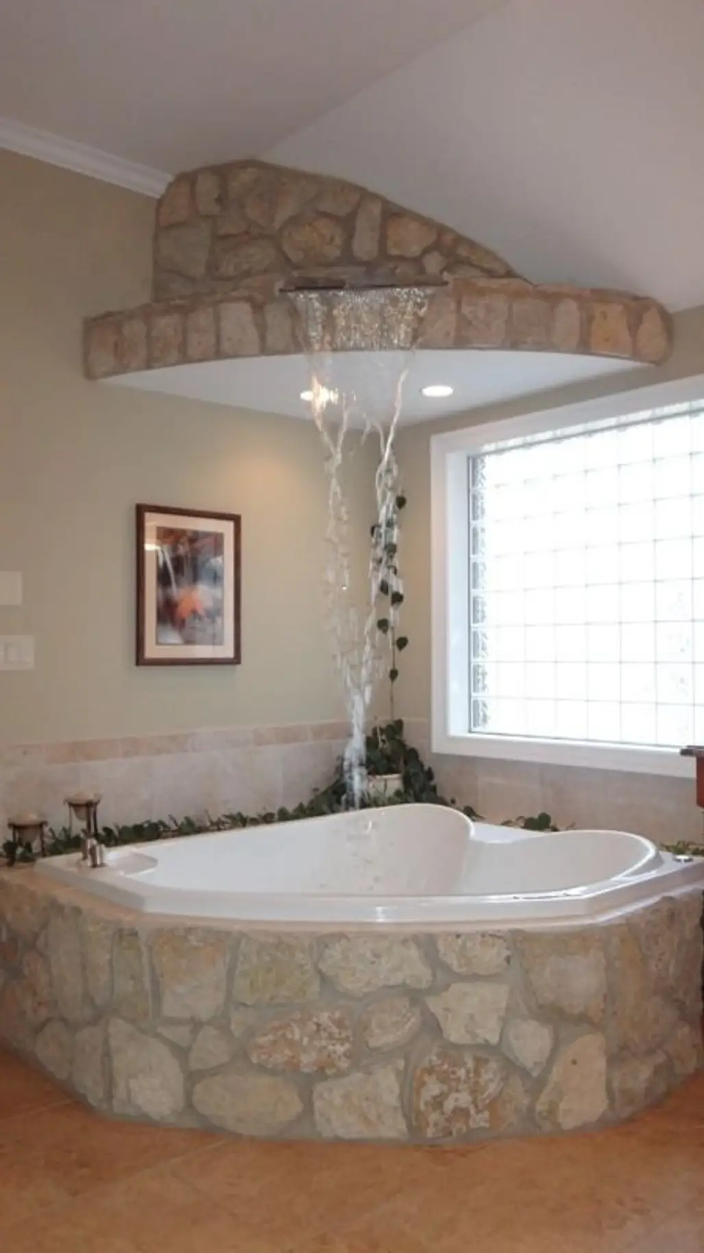 Stone Waterfall Feature Fills the Bubble Jet Tub from above