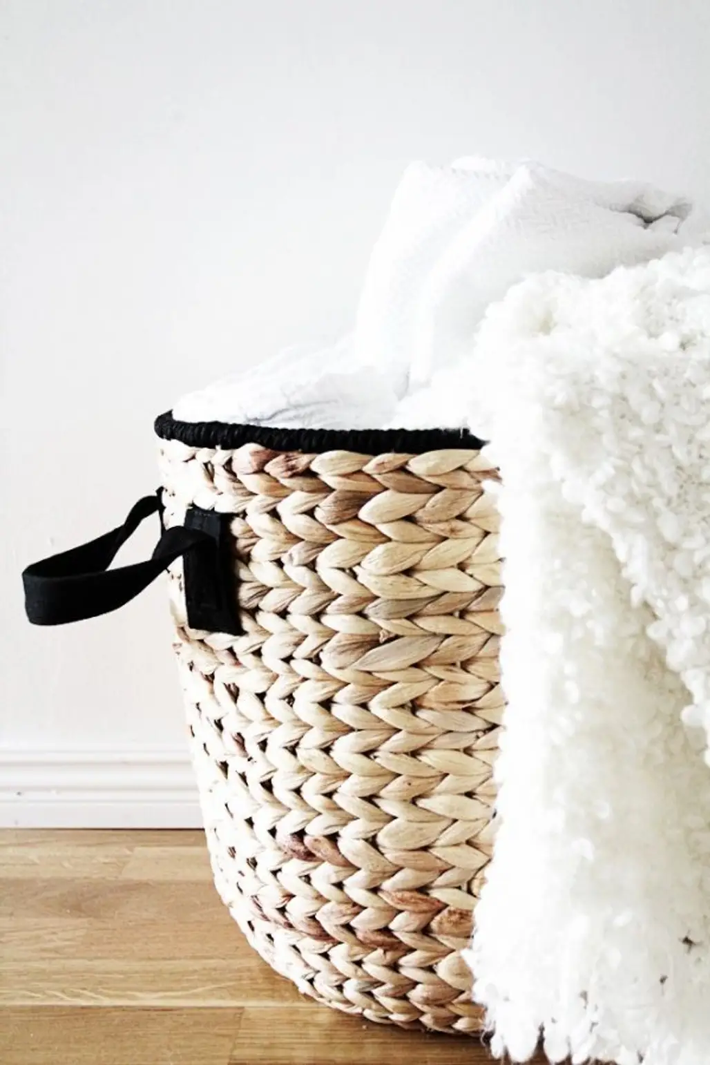 In a Decorative Basket on the Floor