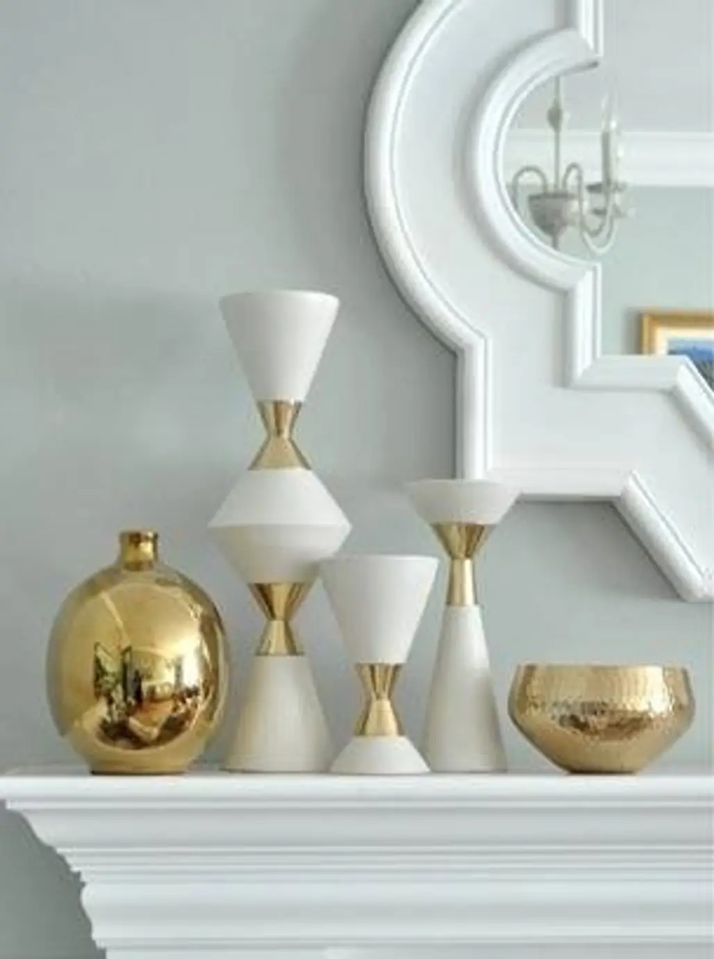 White and Gold Vases on the Mantle