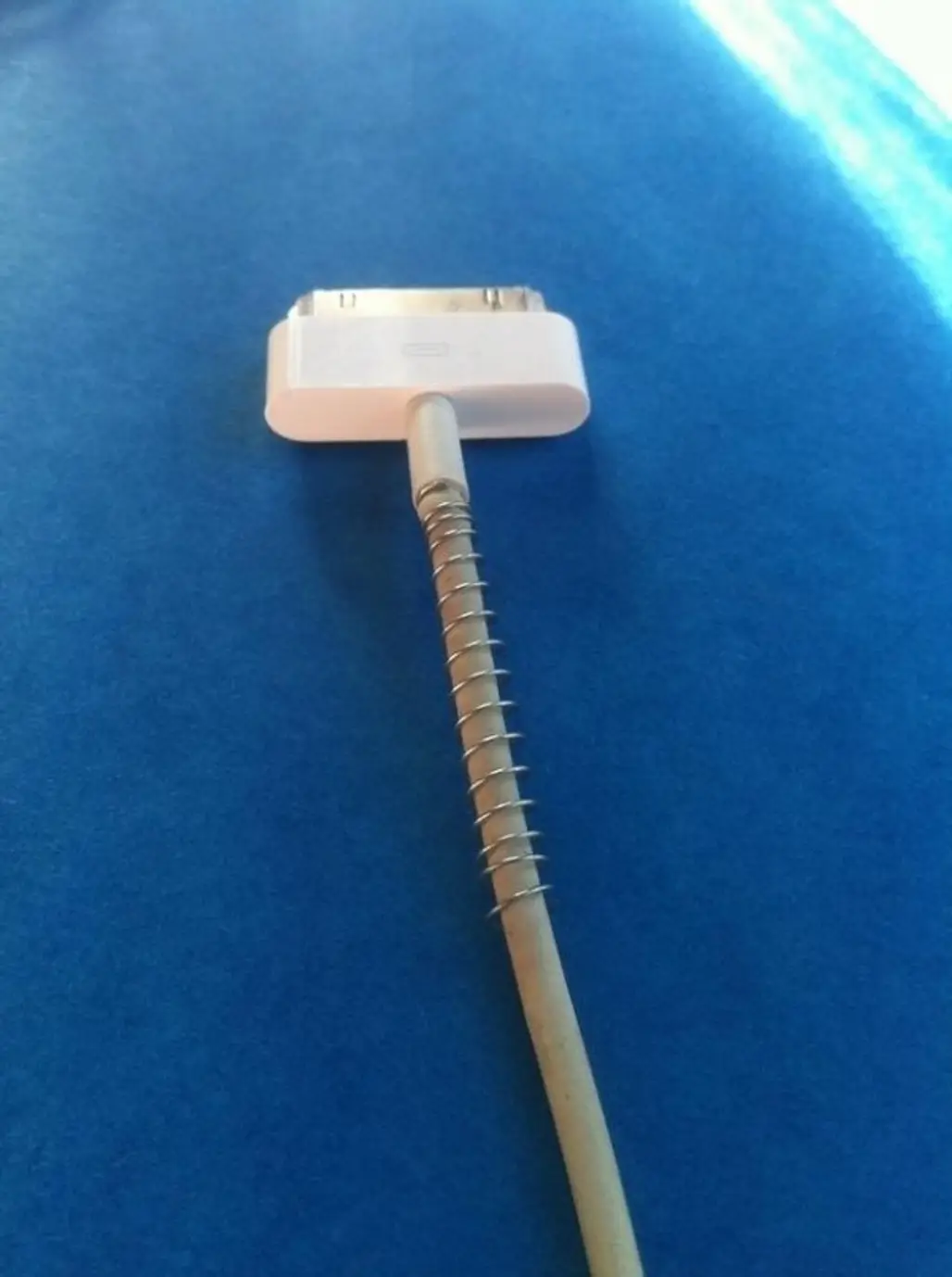 13. Use the Spring from an Old Pen to save Your Charger