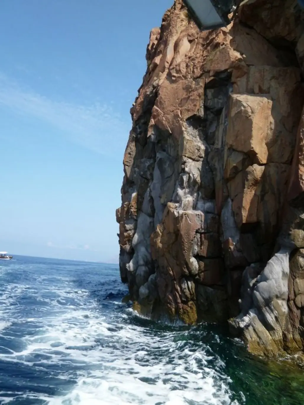 rock,cliff,sculpture,terrain,sea,