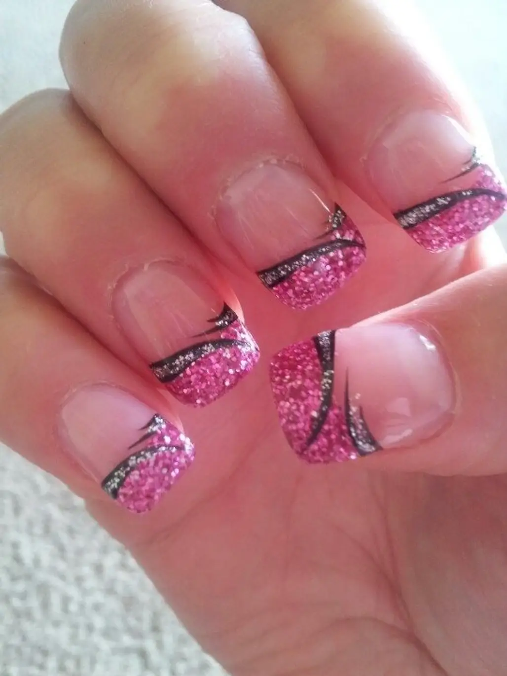 Nails design is in the form of square, color is natural pink, red and  white. A
