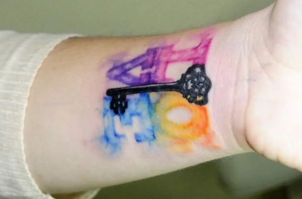 tattoo,finger,arm,hand,organ,
