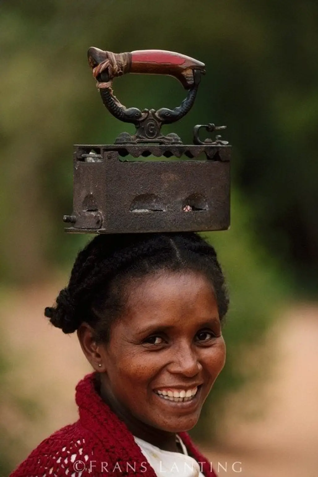 Antandroy Woman Carrying an Iron