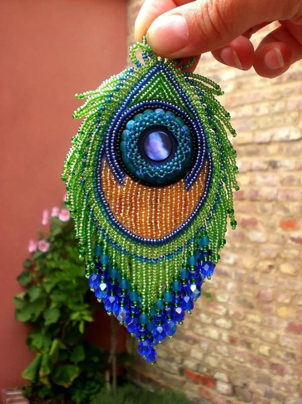 green,fashion accessory,bird,art,bead,