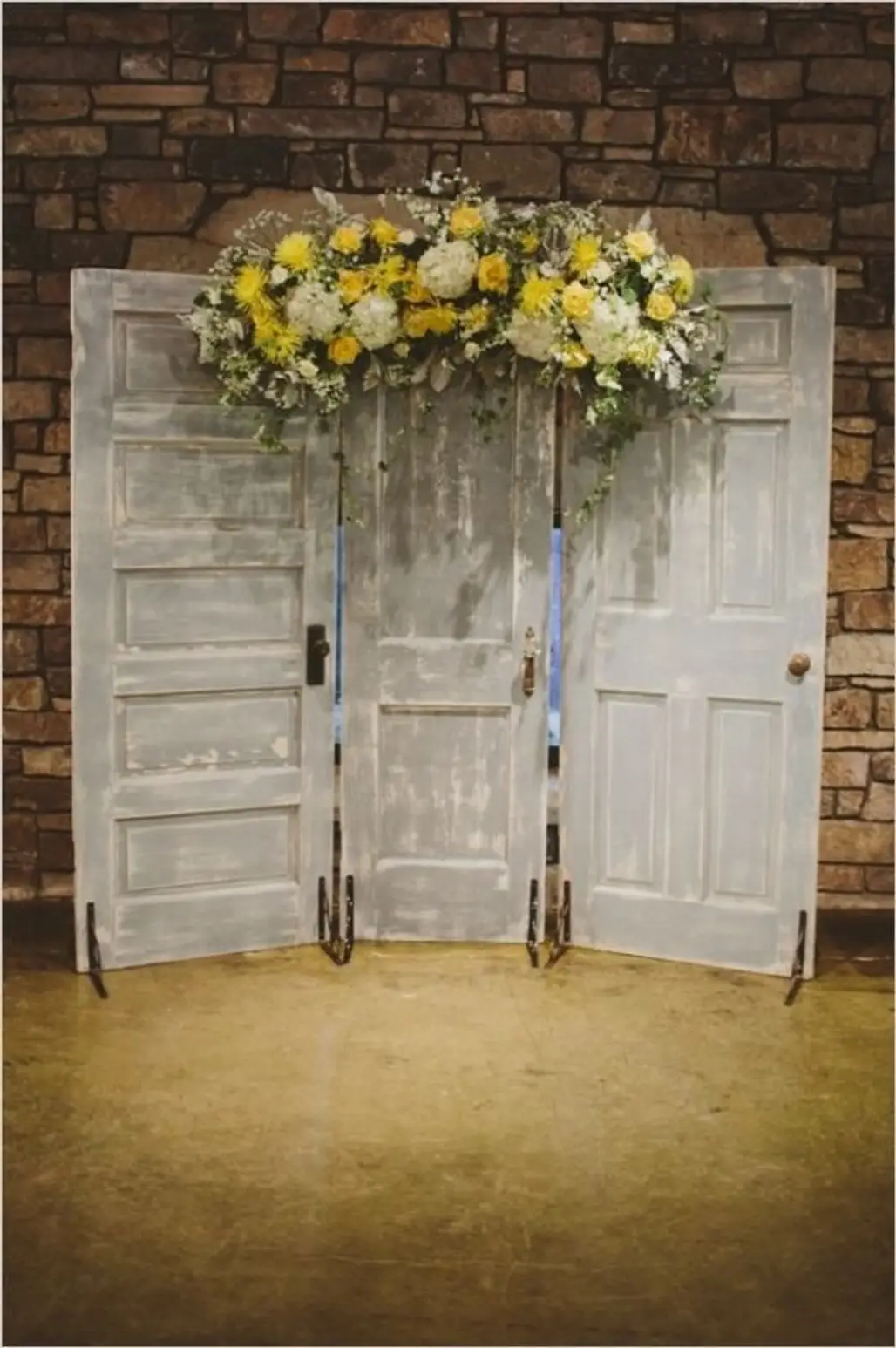Doors with Yellow Floral Arrangement as a Ceremony Backdrop