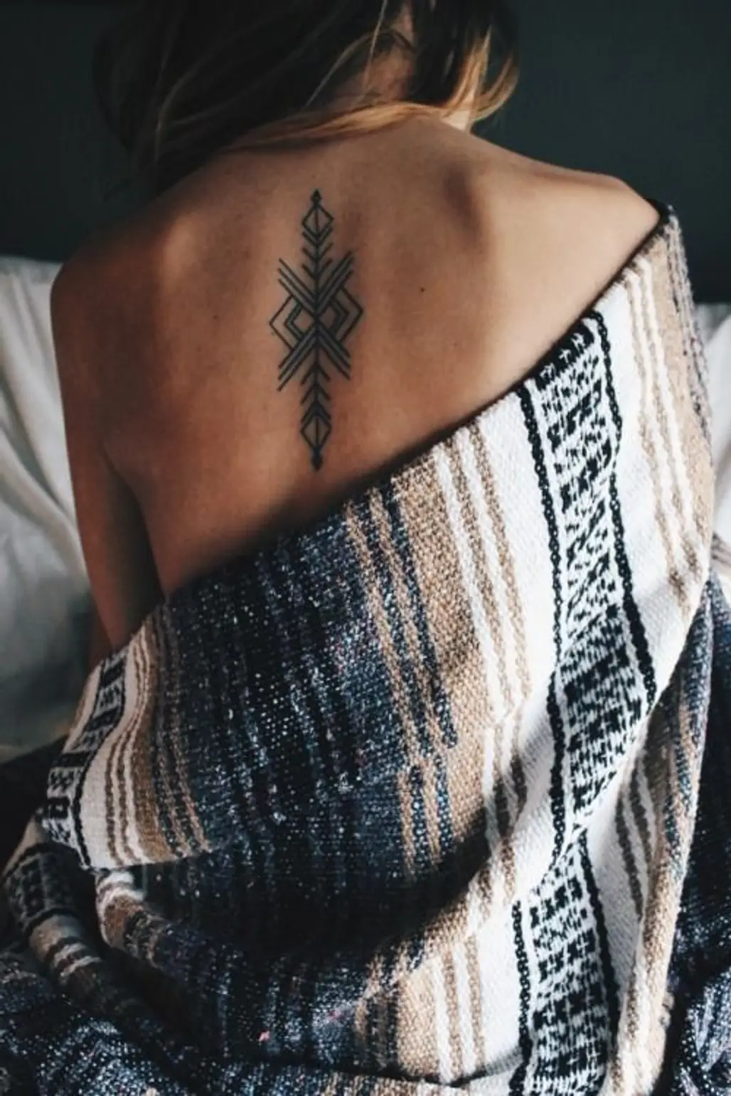 A tattoo of a black tribal style seahorse on a woman's ribs Stock Photo -  Alamy