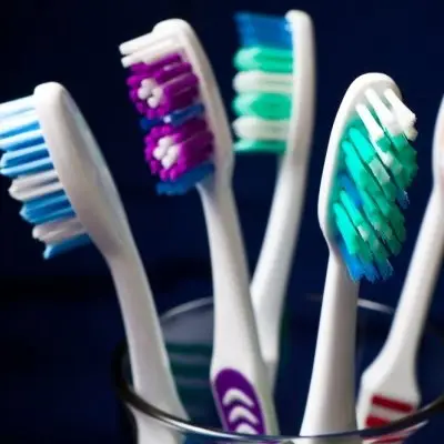 9 Uses for a Toothbrush in Your Beauty Routine ...