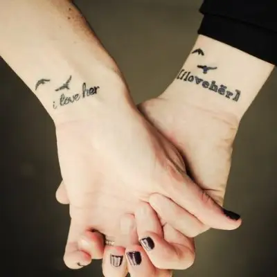 Matching couple tattoos