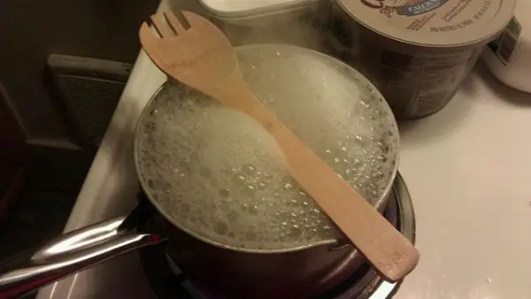 Use a Wooden Spoon to Prevent a Pot of Water from Boiling over
