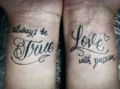 tattoo,arm,font,hand,human body,