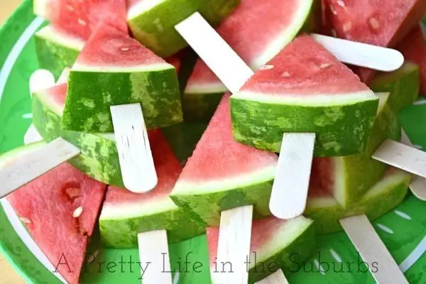Put Watermelon Slices on Popsicle Sticks to Cut down on Messes