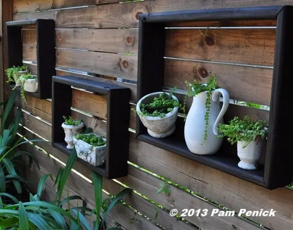 Display Little Potted Plants inside Square Shelves
